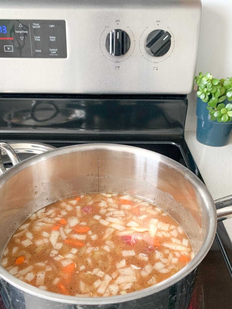 bringing stew to a simmer on the stovetop