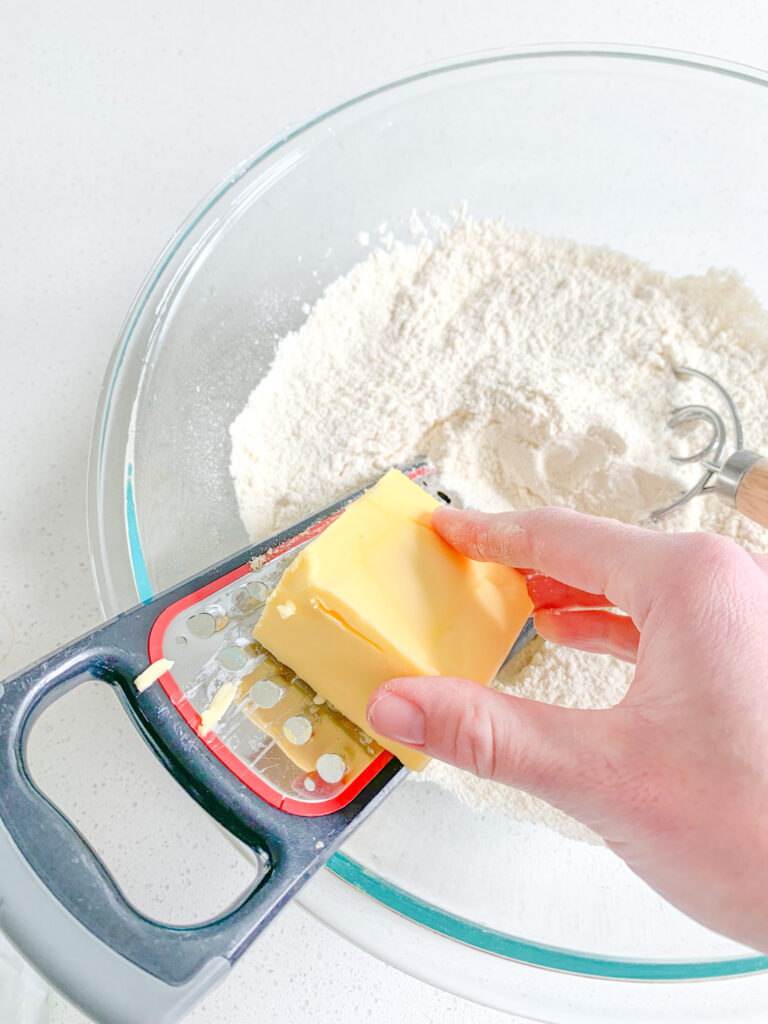 grating butter into dry mixture for scones