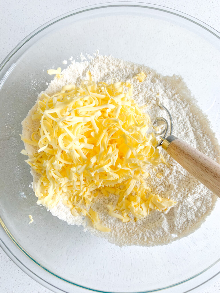 mixing grated butter into dry scone mix