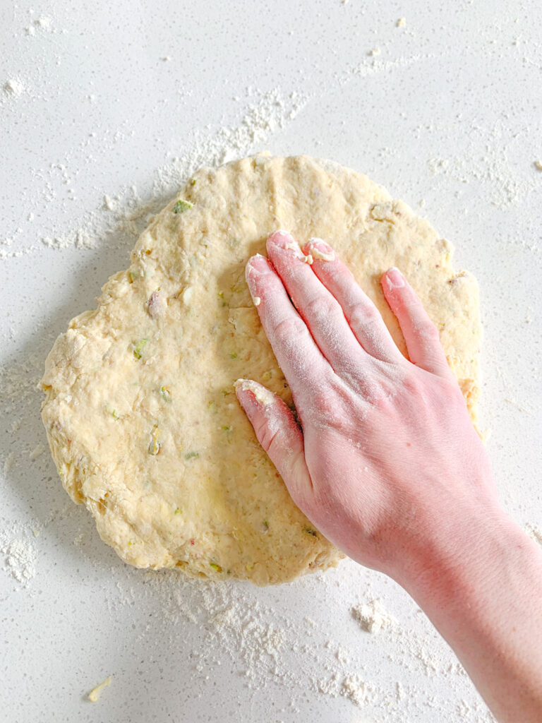 sourdough scone dough patted out with hand