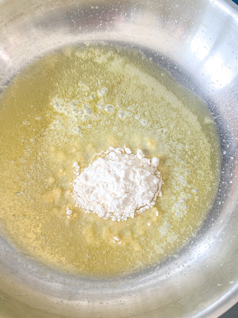whisking flour into butter for mac and cheese sauce roux