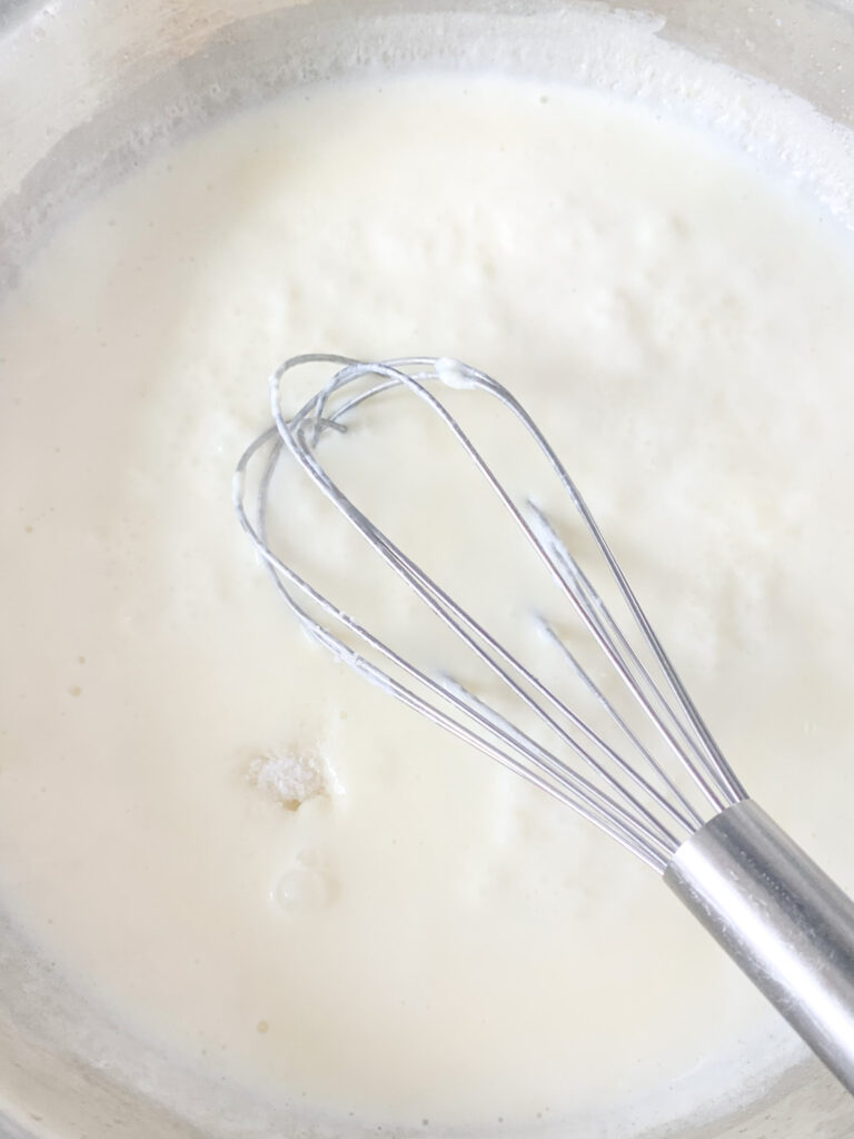 whisking in salt and vinegar for mac and cheese sauce