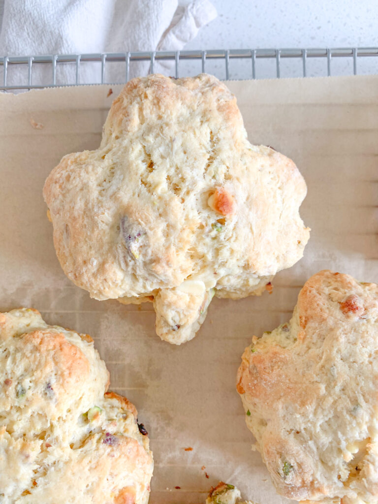 freshly baked white chocolate pistachio sourdough shamrock scones