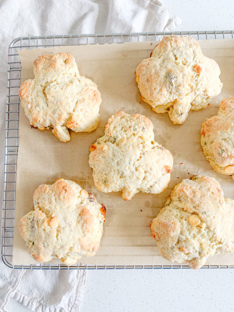 freshly baked white chocolate pistachio sourdough shamrock scones