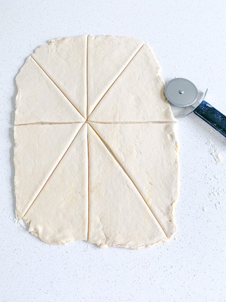homemade sourdough crescent dough sliced into 8 triangles