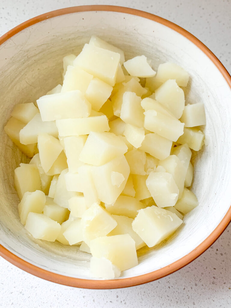 cooked potatoes in a bowl set aside