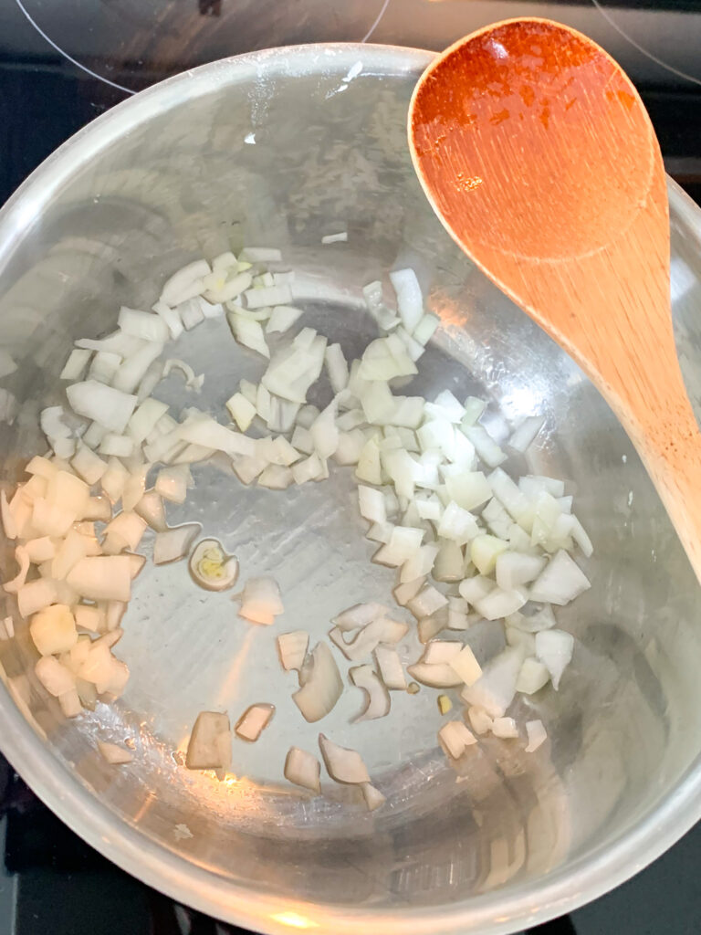 onions and avocado oil simmer in a pot