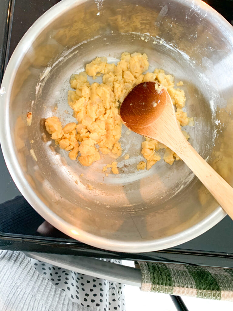 flour added to melted butter and onions to make a thickening roux for the soup
