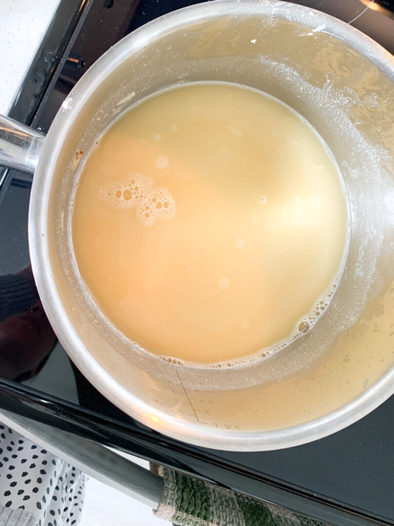 chicken stock added to roux and whisk to combine