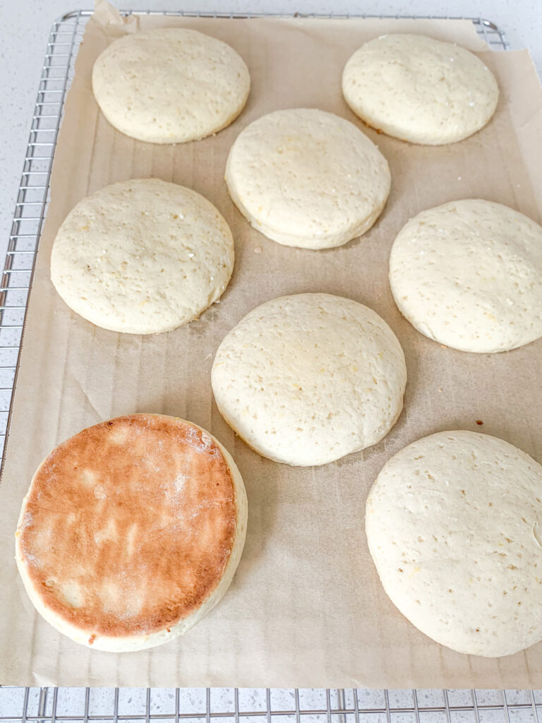 freshly baked sourdough lemon cookies cooling on a wire rack