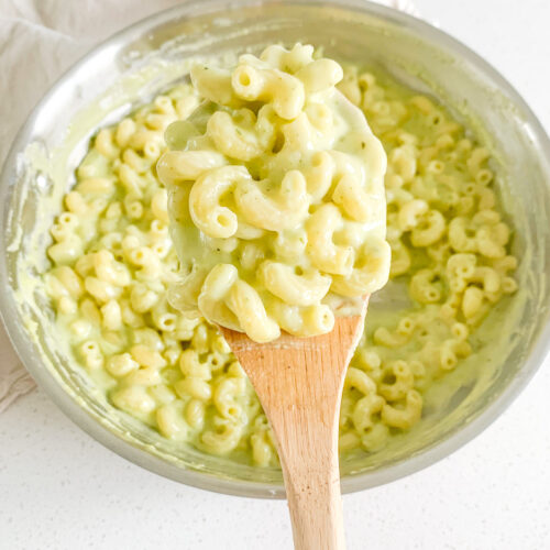 freshly made pesto mac and cheese getting served