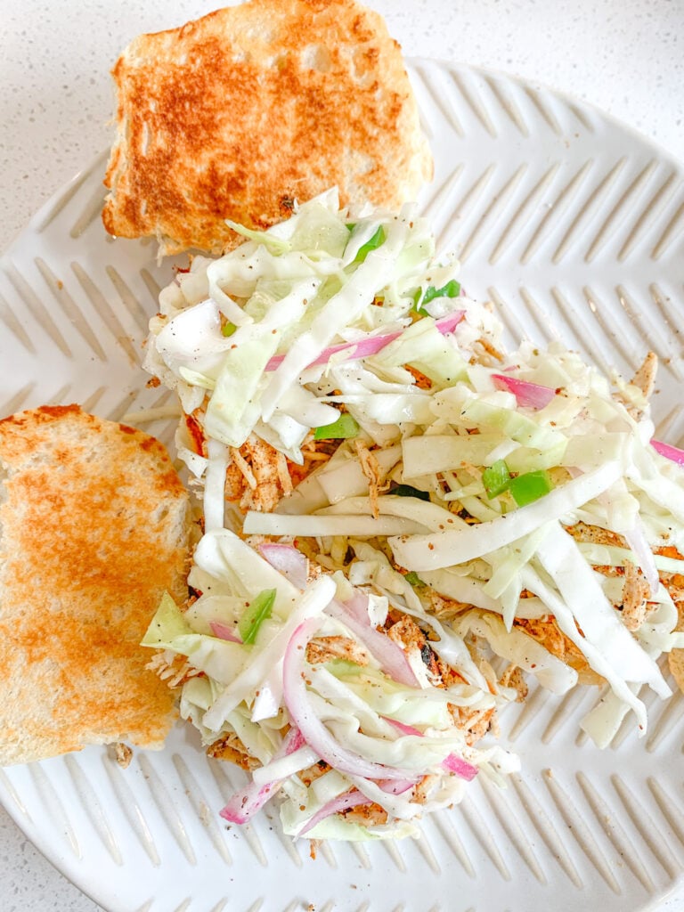 slaw added to chicken sliders