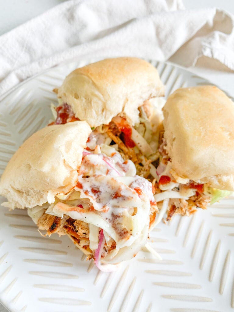 freshly made pulled chicken sliders with vinegar slaw