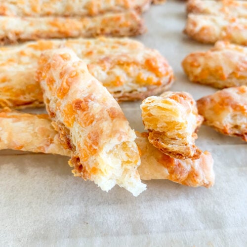 freshly baked sourdough southern cheese straws broke in half
