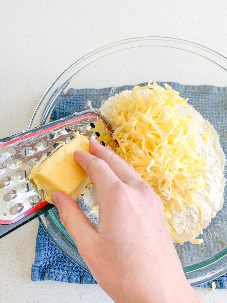 grating butter into dry ingredients for biscuits