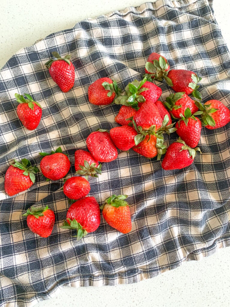 washed and dried strawberries on a towel