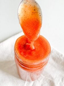 freshly made homemade Tennessee BBQ sauce getting served with a spoon