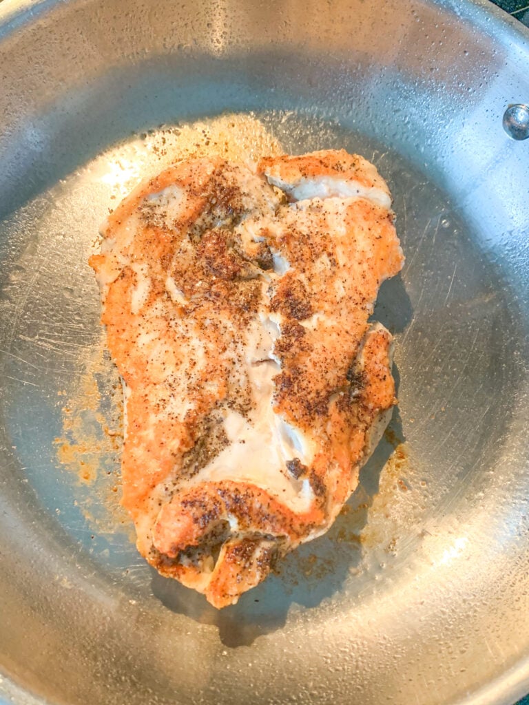 pan searing chicken breast on the stovetop