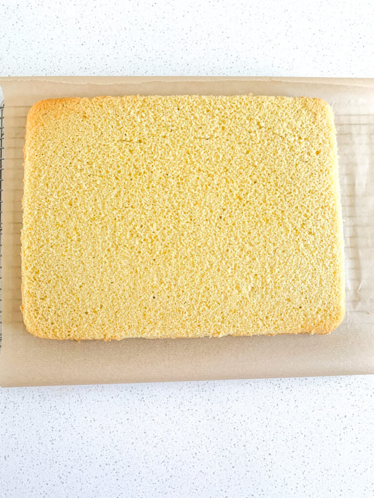 sourdough lemon sheet cake cooling on a rack