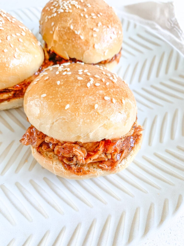 freshly assembled shredded bbq chicken sandwiches