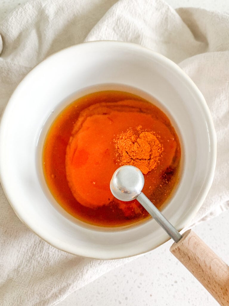 making hot honey sauce in a bowl