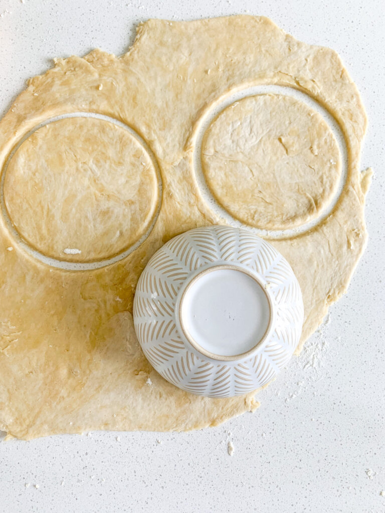 cutting out circles in sourdough pie dough