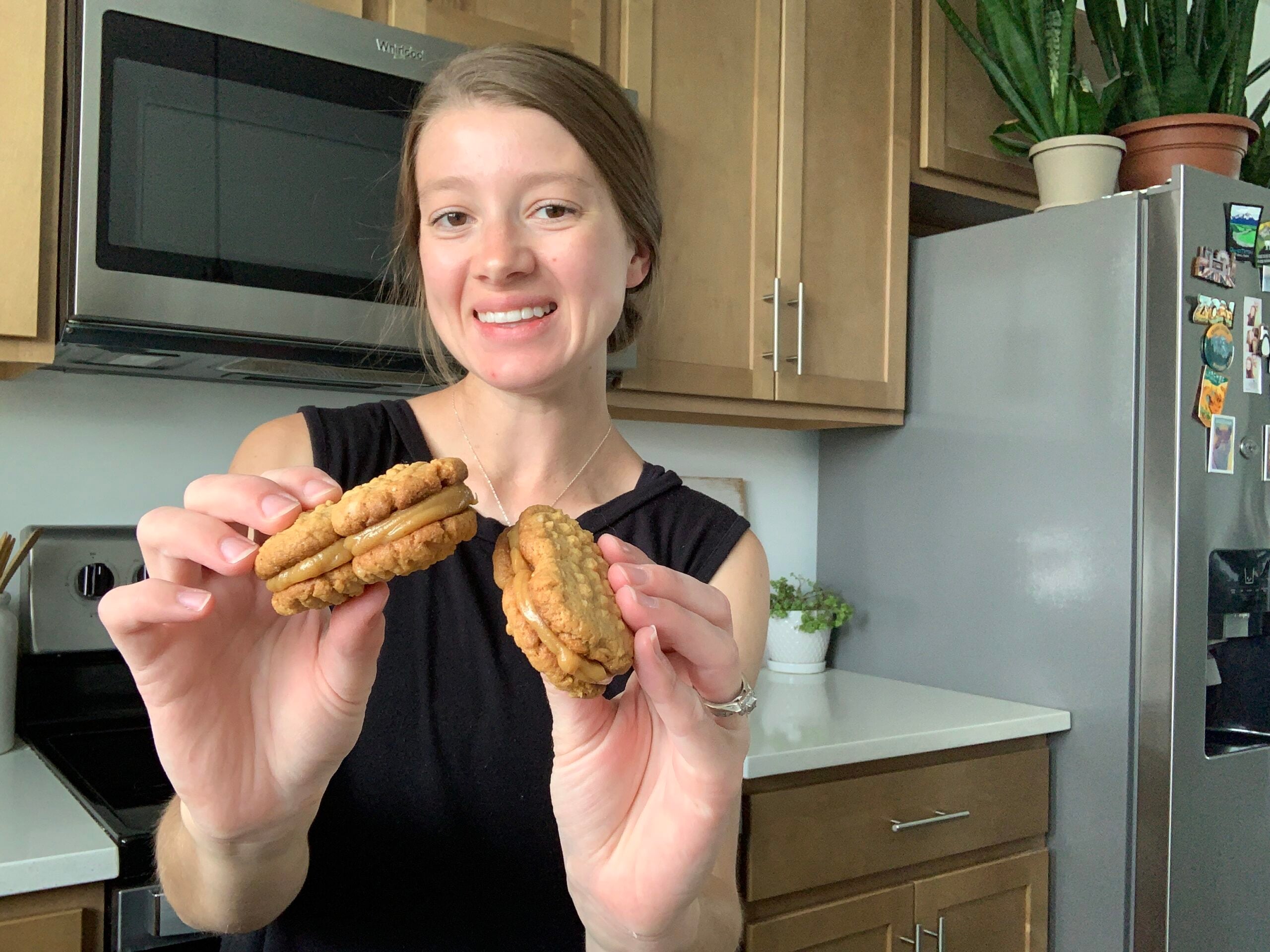 molly lafontaine holding her homemade sourdough nutter butter cookies