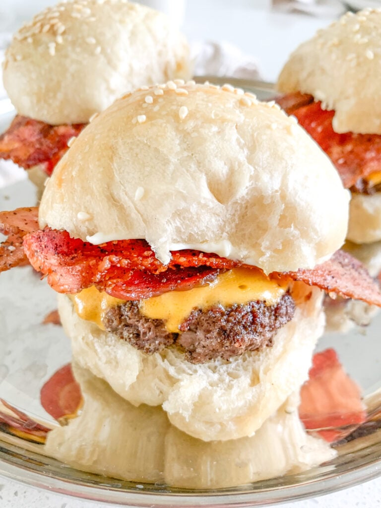 freshly made and assembled bacon cheese burger sliders