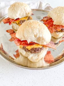 freshly made and assembled bacon cheese burger sliders
