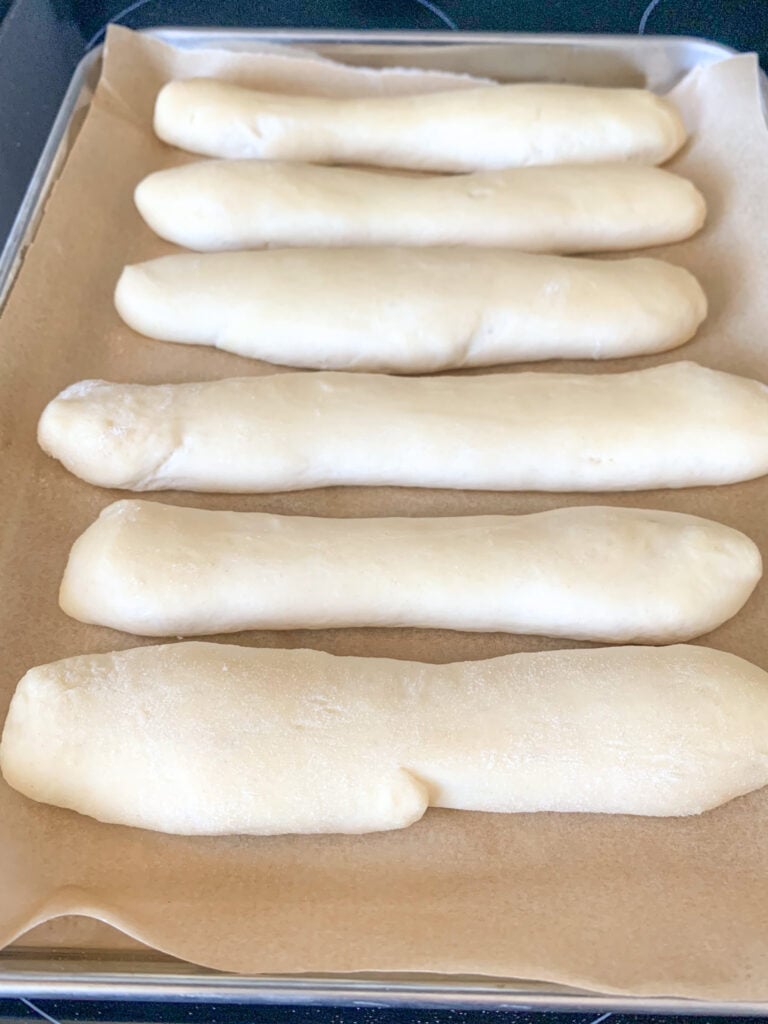 proofed breadsticks ready for baking