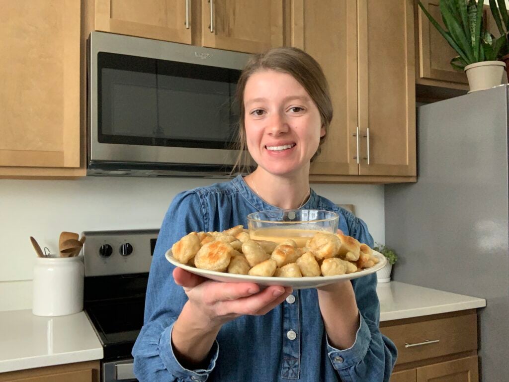 Molly LaFontaine, founder of Plum Branch Home, holding sourdough pretzel bites