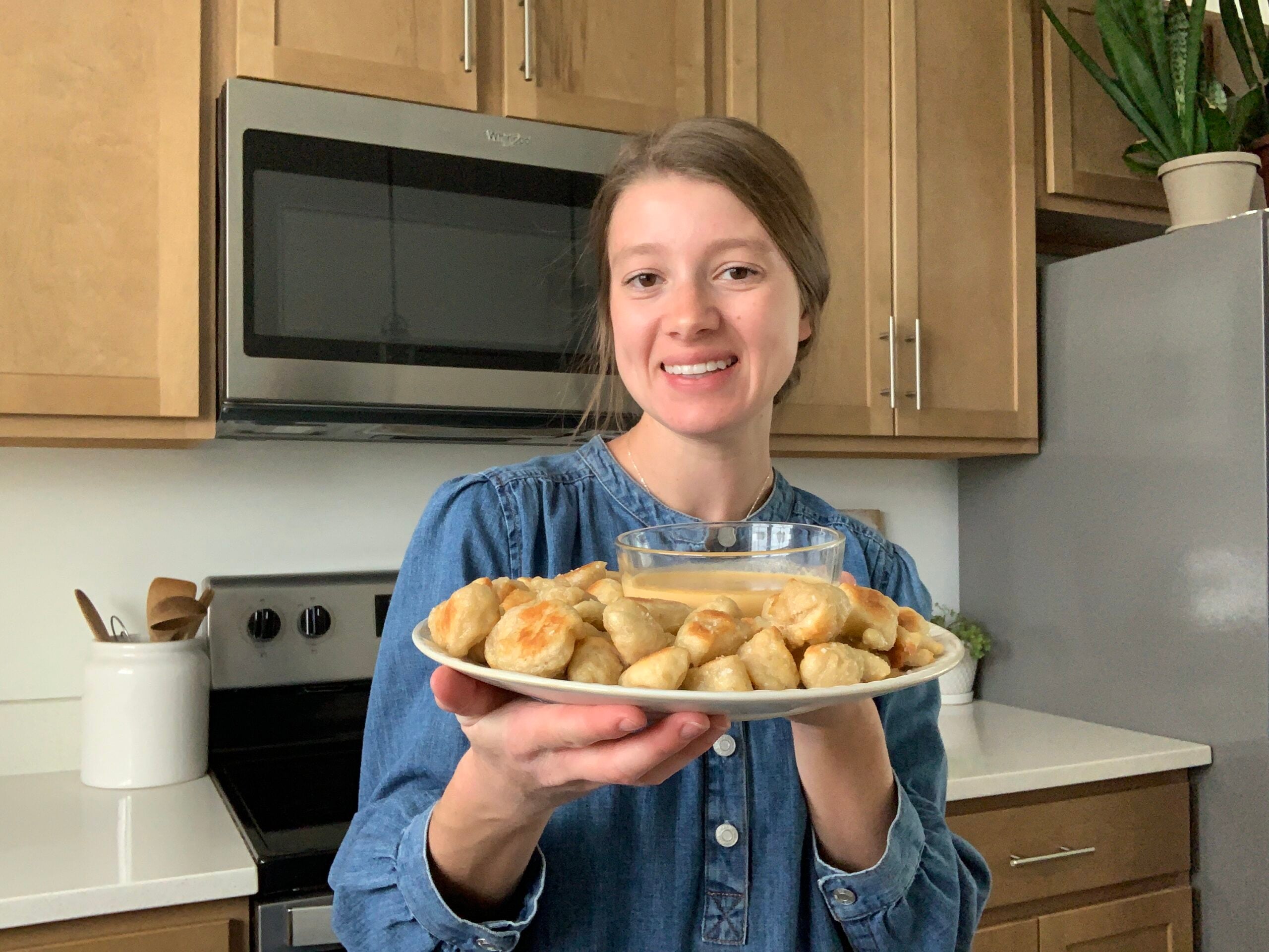 Molly LaFontaine, founder of Plum Branch Home, holding sourdough pretzel bites