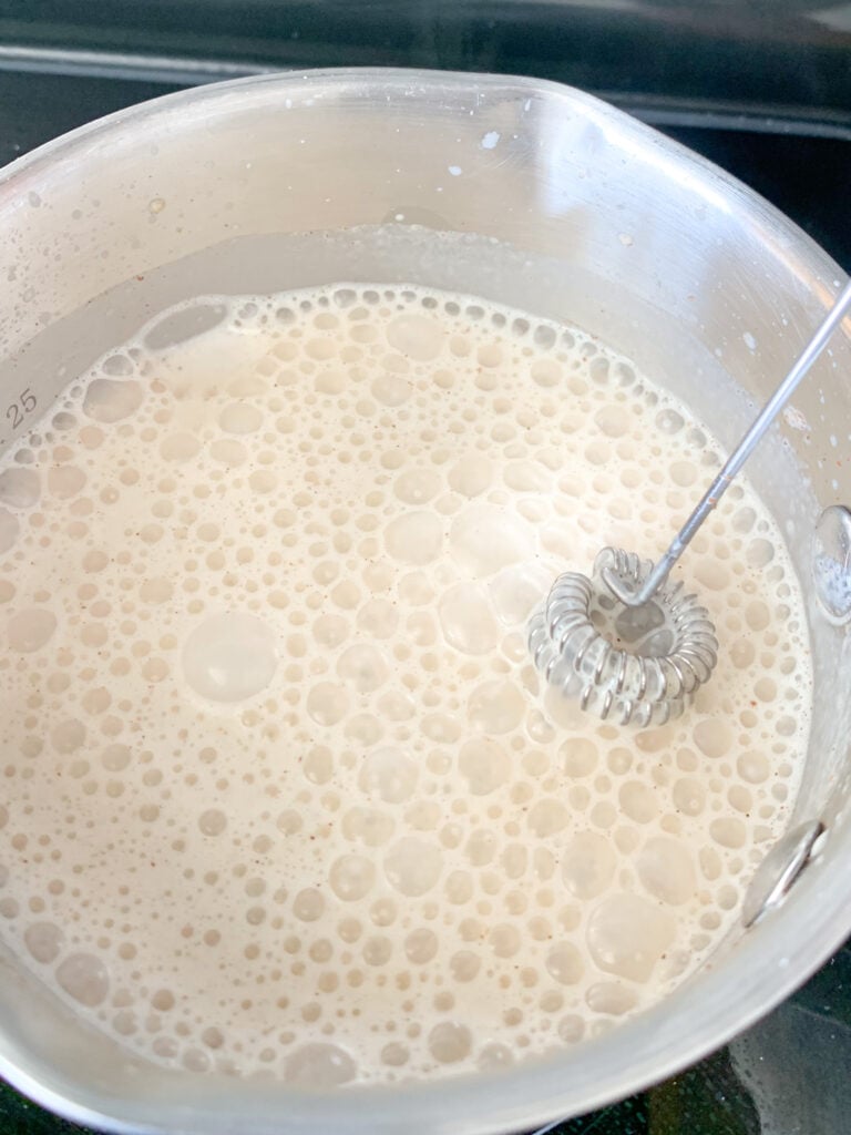 whisking pumpkin cream together