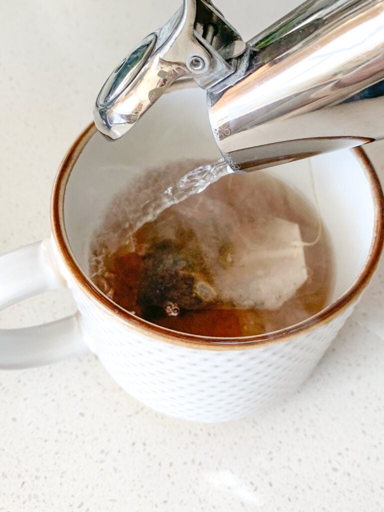 pour water over tea bag to brew tea