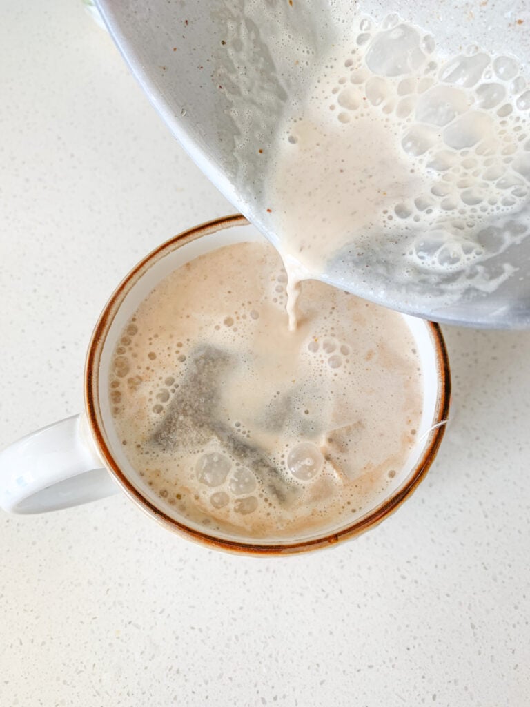 adding pumpkin cream mixture to tea