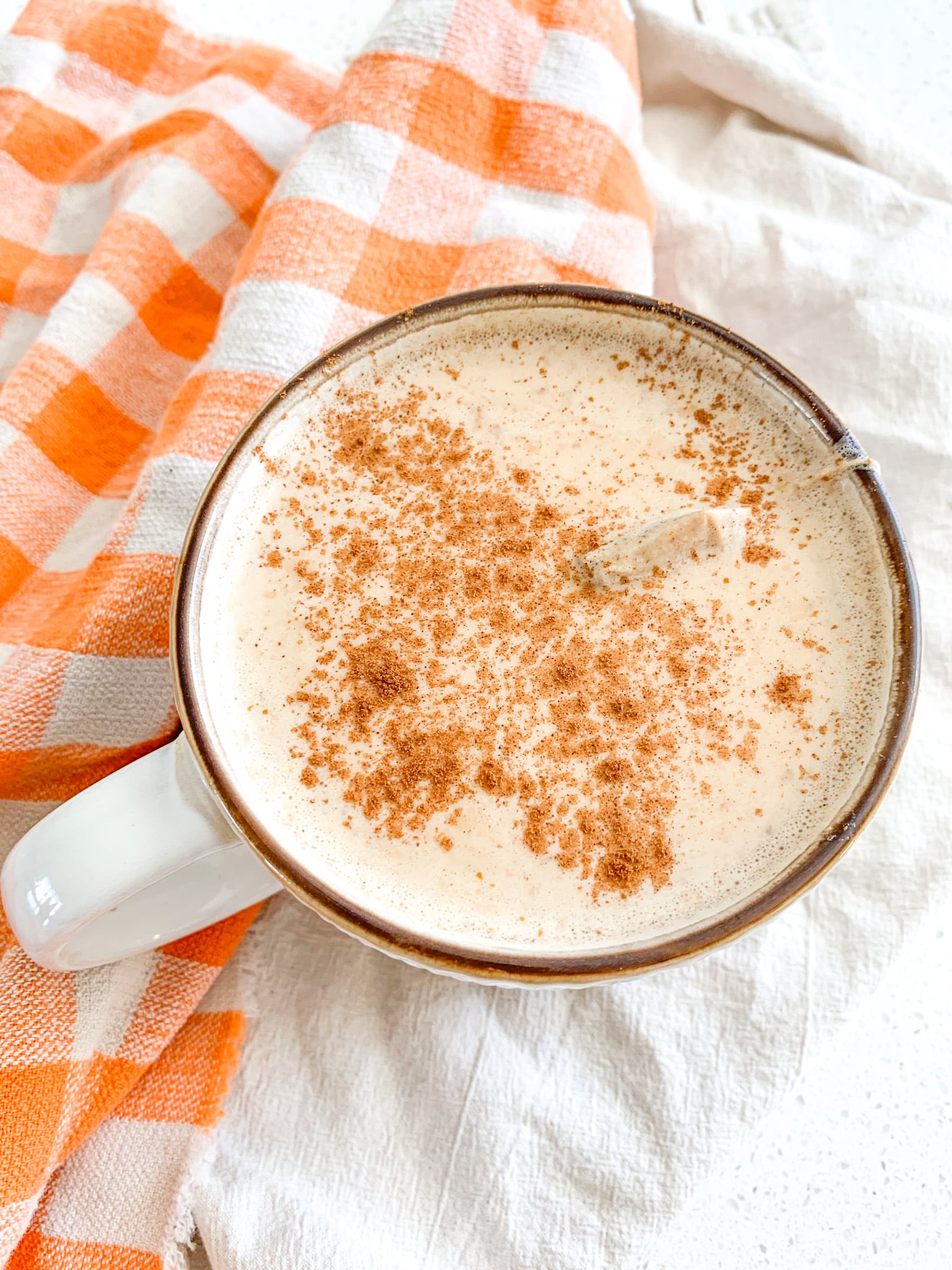 freshly made pumpkin chai latte with cinnamon on top