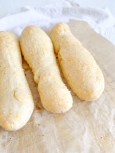 freshly baked sourdough breadsticks with garlic butter