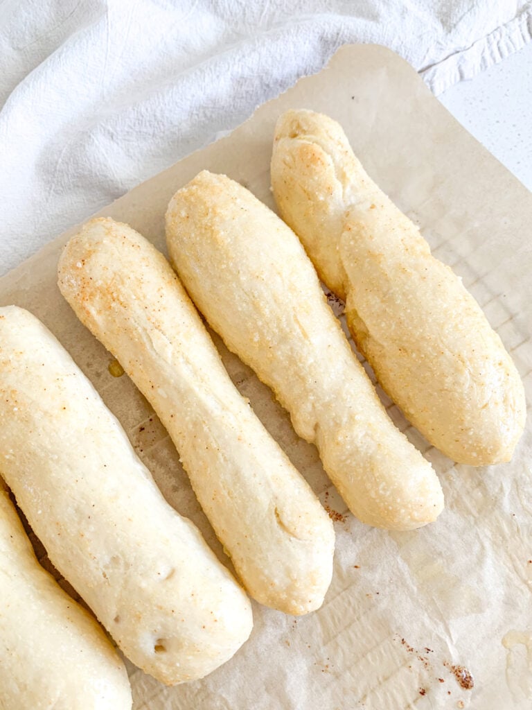 freshly baked sourdough breadsticks with garlic butter