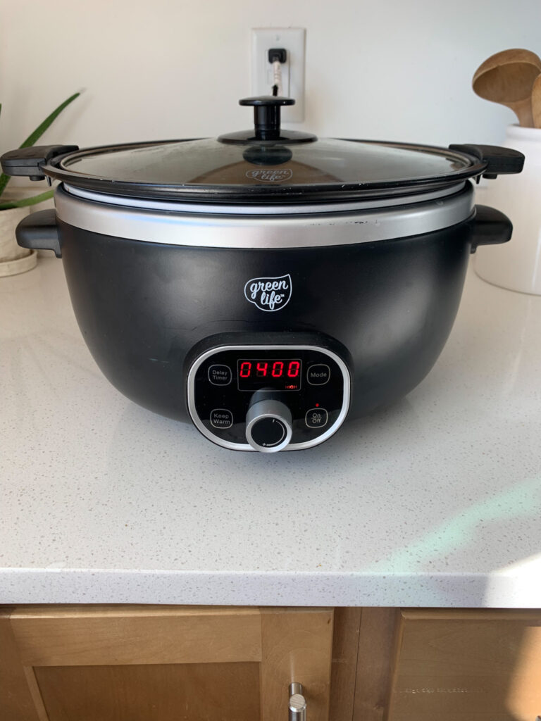 buffalo chicken and sweet potatoes cooking in slow cooker