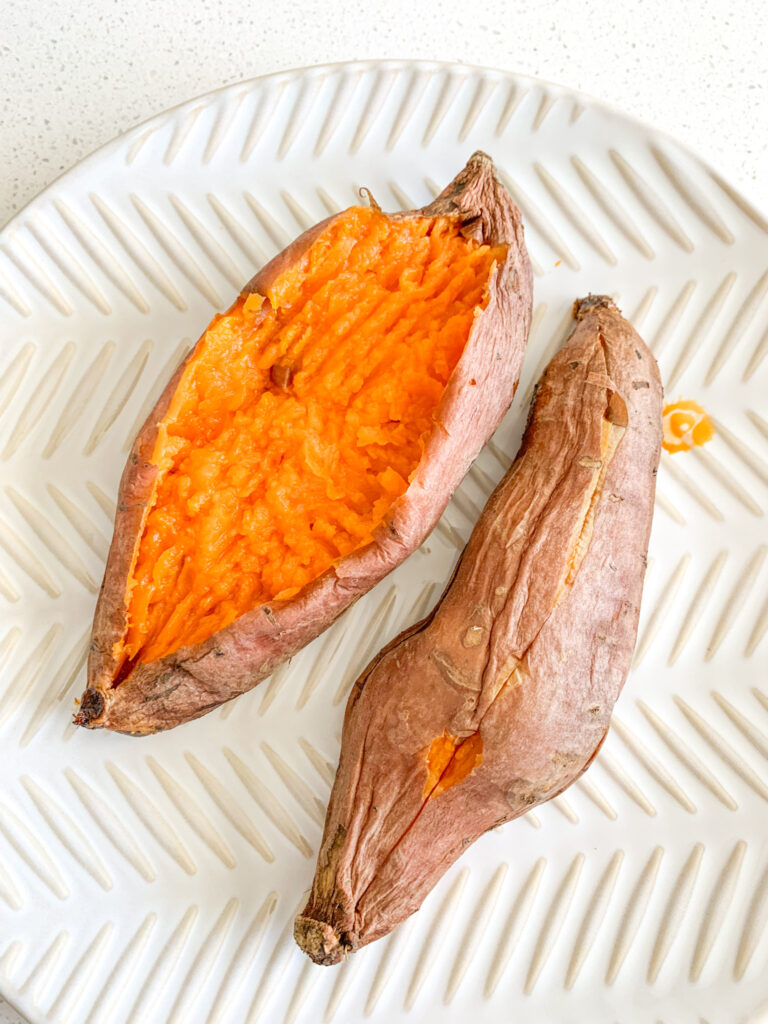 sweet potato cut up and insides fluffed up